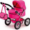 Een trendy roze poppenwagen met een handige roze tas aan het stuur